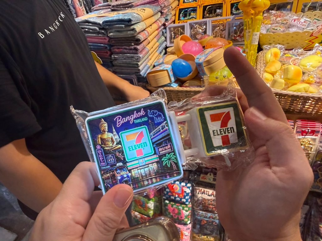 Packaged 7-Eleven Bangkok souvenir with Buddha, tuk-tuk, and Sawasdee graphics