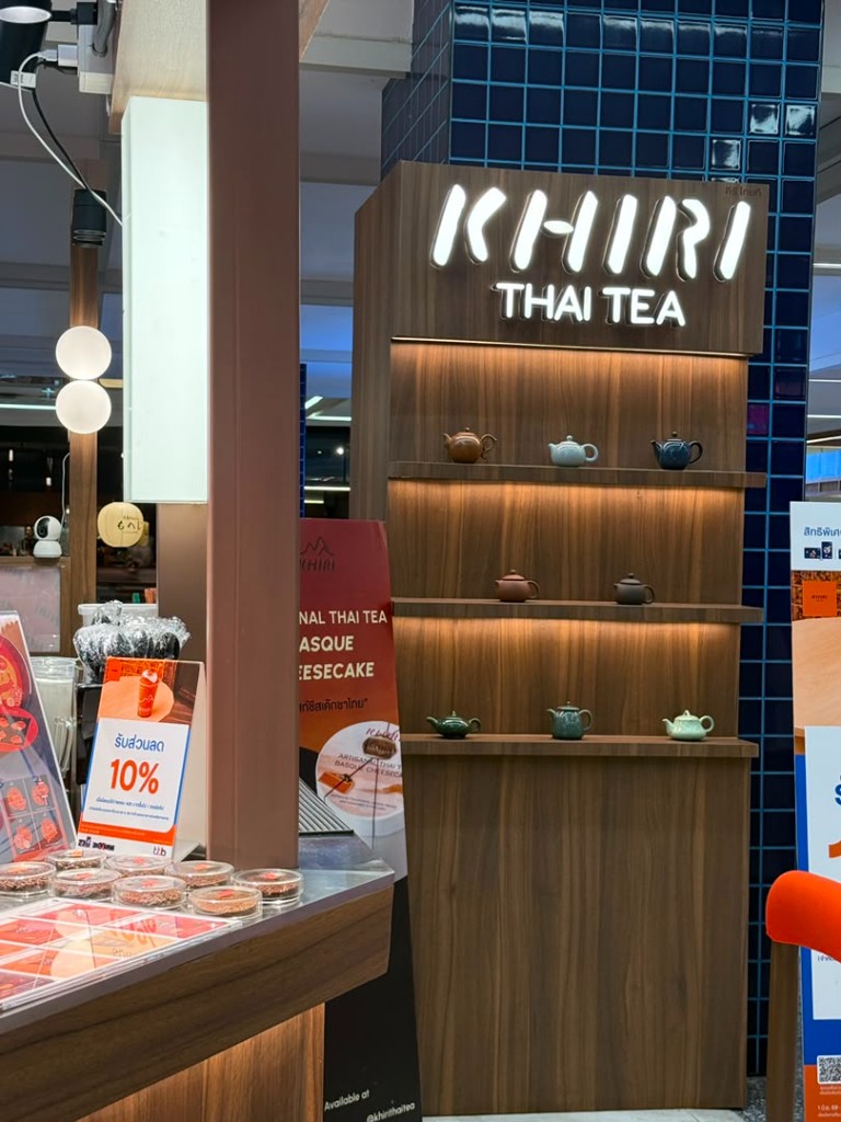 KHIRI Thai Tea shopfront with wooden shelves of ceramic teapots