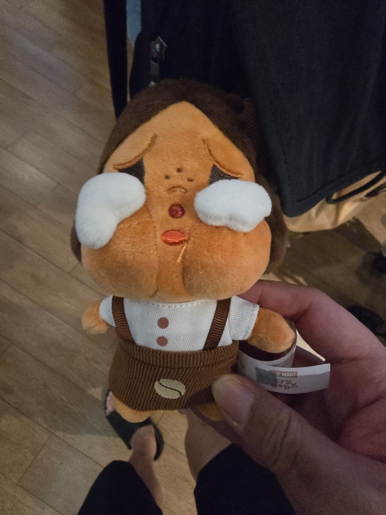 Pop Mart Crybaby Coffee Factory plush held in hand